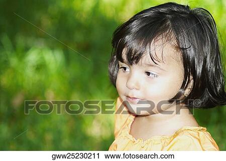 Close-up of a girl looking away View Large Photo Image Stock Image - Close-up of a girl looking away. Fotosearch