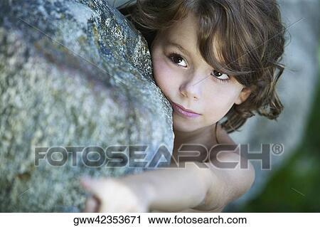 Close-up of a girl looking away View Large Photo Image Stock Image - Close-up of a girl looking away. Fotosearch