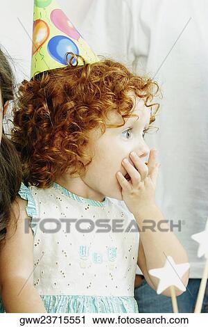 Close-up of a girl looking shocked View Large Photo Image Stock Image - Close-up of a girl looking shocked. Fotosearch