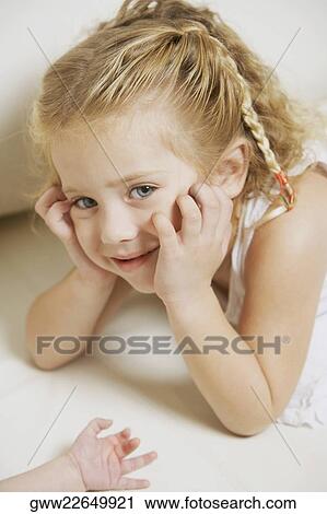 Stock Image - Close-up of a girl smiling. Fotosearch