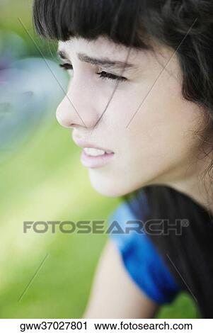 Close-up of a girl thinking View Large Photo Image Stock Image - Close-up of a girl thinking. Fotosearch