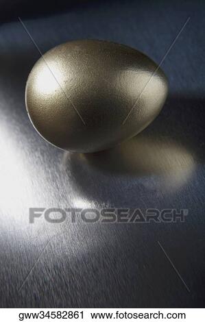 Close-up of a golden egg View Large Photo Image Stock Image - Close-up of a golden egg. Fotosearch