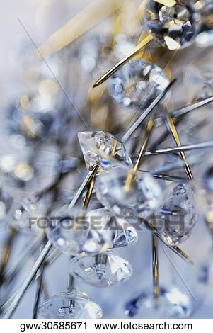 Stock Image - Close-up of a group of straight pins. Fotosearch