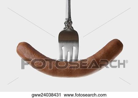 Close-up of a hotdog with a fork View Large Photo Image Stock Image - Close-up of a hotdog with a fork. Fotosearch