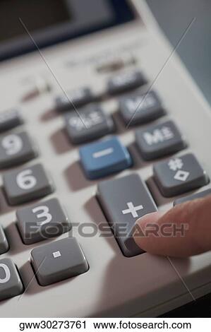 Close-up of a human finger pressing buttons of a calculator View Large Photo Image Stock Image - Close-up of a human finger pressing buttons of a calculator. Fotosearch