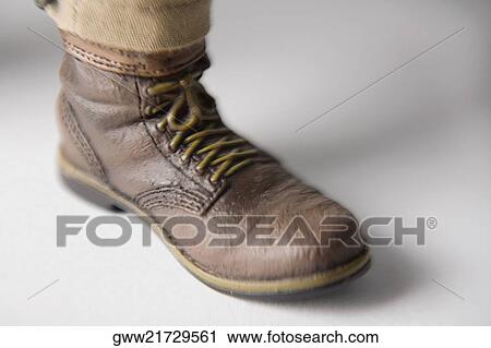 Close-up of a human foot wearing a shoe View Large Photo Image Stock Image - Close-up of a human foot wearing a shoe. Fotosearch
