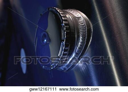 Stock Image - Close-up of a lid of a metal container. Fotosearch