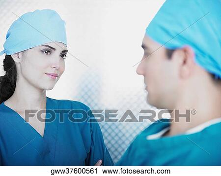 Close-up of a male and a female doctor looking at each other View Large Photo Image Stock Image - Close-up of a male and a female doctor looking at each other. Fotosearch