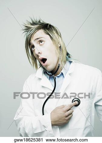 Close-up of a male doctor examining himself with a stethoscope View Large Photo Image Stock Image - Close-up of a male doctor examining himself with a stethoscope. Fotosearch