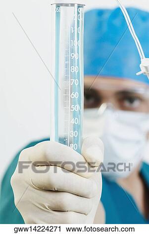 Close-up of a male doctor holding a syringe View Large Photo Image Stock Image - Close-up of a male doctor holding a syringe. Fotosearch