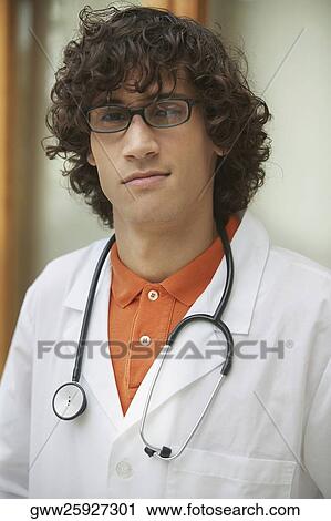 Stock Image - Close-up of a male doctor wearing a stethoscope. Fotosearch