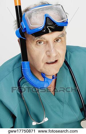 Close-up of a male doctor with a snorkel on his head View Large Photo Image Stock Image - Close-up of a male doctor with a snorkel on his head. Fotosearch