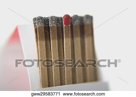 Stock Image - Close-up of a matchstick with burnt match sticks. Fotosearch