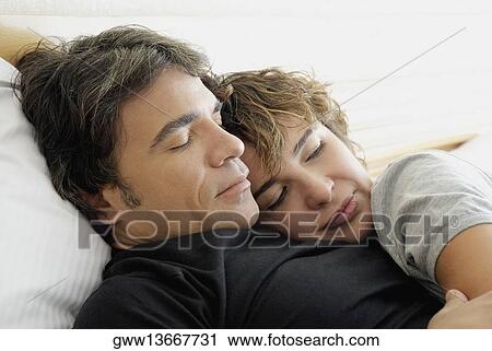 Close-up of a mature couple sleeping View Large Photo Image Stock Image - Close-up of a mature couple sleeping. Fotosearch