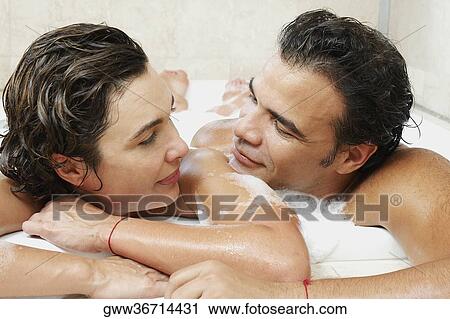 Close-up of a mature couple taking bath in a bathtub View Large Photo Image Stock Image - Close-up of a mature couple taking bath in a bathtub. Fotosearch