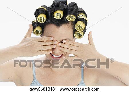 Close-up of a mature woman covering her eyes with her hands View Large Photo Image Stock Image - Close-up of a mature woman covering her eyes with her hands. Fotosearch