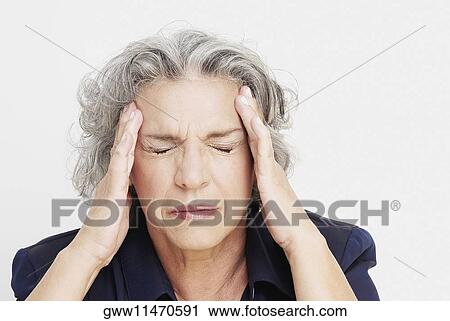 Close-up of a mature woman with a headache View Large Photo Image Stock Image - Close-up of a mature woman with a headache. Fotosearch