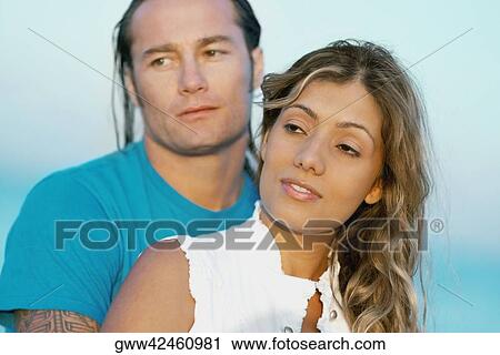 Close-up of a mid adult man and a young woman on the beach View Large Photo Image Stock Image - Close-up of a mid adult man and a young woman on the beach. Fotosearch