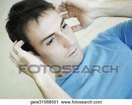 Close-up of a mid adult man exercising View Large Photo Image Stock Image - Close-up of a mid adult man exercising. Fotosearch