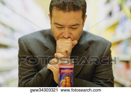 Close-up of a mid adult man praying View Large Photo Image Stock Image - Close-up of a mid adult man praying. Fotosearch