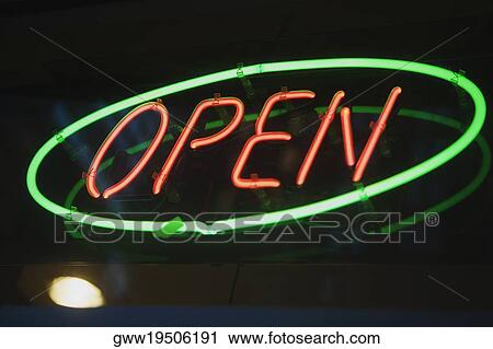 Close-up of a neon open sign lit up at night View Large Photo Image Stock Image - Close-up of a neon open sign lit up at night. Fotosearch