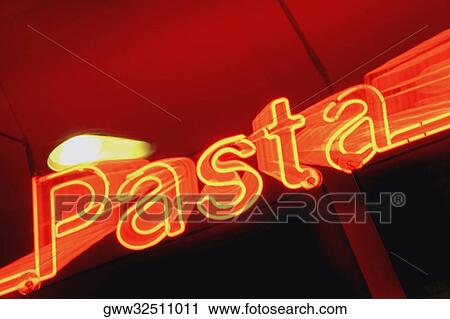 Close-up of a neon sign lit up at night View Large Photo Image Stock Image - Close-up of a neon sign lit up at night. Fotosearch
