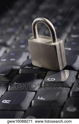Stock Image - Close-up of a padlock on a computer keyboard. Fotosearch