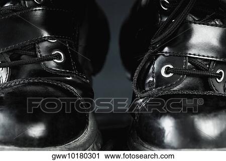 Close-up of a pair of boots View Large Photo Image Stock Image - Close-up of a pair of boots. Fotosearch