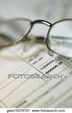 Close-up of a pair of eyeglasses on a financial report View Large Photo Image Stock Image - Close-up of a pair of eyeglasses on a financial report. Fotosearch