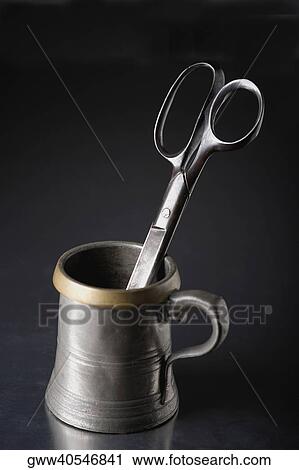 Close-up of a pair of scissors in a cup View Large Photo Image Stock Image - Close-up of a pair of scissors in a cup. Fotosearch