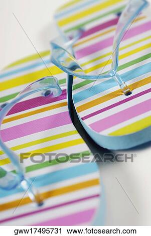 Close-up of a pair of slippers View Large Photo Image Stock Image - Close-up of a pair of slippers. Fotosearch