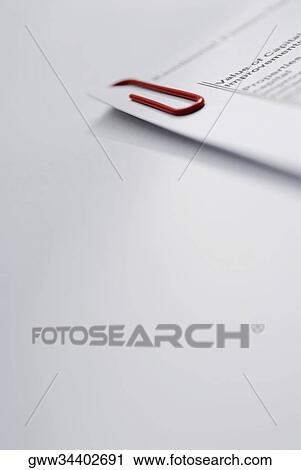 Close-up of a paper clip on documents View Large Photo Image Stock Image - Close-up of a paper clip on documents. Fotosearch