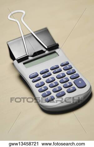 Close-up of a paper clip with a calculator View Large Photo Image Stock Image - Close-up of a paper clip with a calculator. Fotosearch