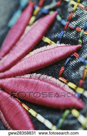 Stock Image - Close-up of a patch on denim. Fotosearch