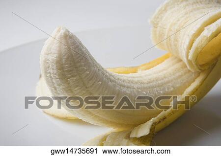 Close-up of a peeled banana View Large Photo Image Stock Image - Close-up of a peeled banana. Fotosearch