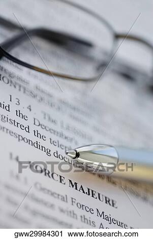 Stock Image - Close-up of a pen and eyeglasses on paper. Fotosearch