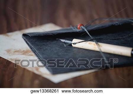 Close-up of a pen on a fie View Large Photo Image Stock Image - Close-up of a pen on a fie. Fotosearch