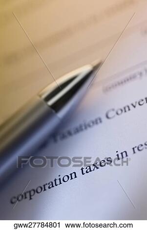 Close-up of a pen on a financial document View Large Photo Image Stock Image - Close-up of a pen on a financial document. Fotosearch