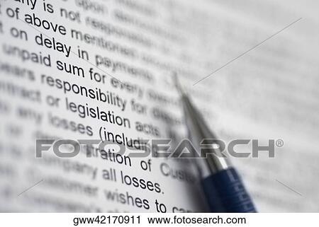 Close-up of a pen on a financial document View Large Photo Image Stock Image - Close-up of a pen on a financial document. Fotosearch