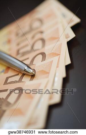 Close-up of a pen on fifty Euro banknotes View Large Photo Image Stock Image - Close-up of a pen on fifty Euro banknotes. Fotosearch