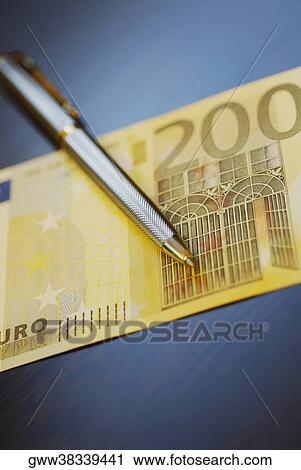 Close-up of a pen on two hundred Euro banknote View Large Photo Image Stock Image - Close-up of a pen on two hundred Euro banknote. Fotosearch