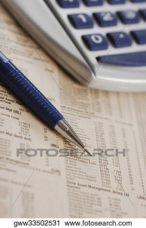 Close-up of a pen with a calculator on stock market data sheet View Large Photo Image Stock Image - Close-up of a pen with a calculator on stock market data sheet. Fotosearch
