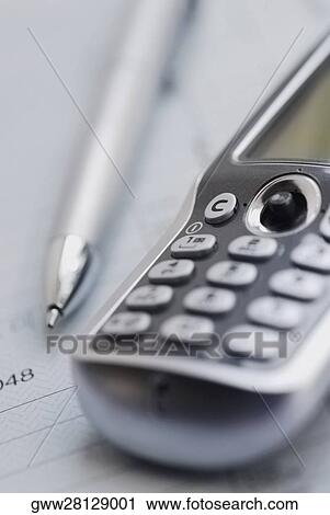 Close-up of a pen with a mobile phone on a form View Large Photo Image Stock Image - Close-up of a pen with a mobile phone on a form. Fotosearch