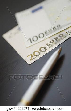 Close-up of a pen with Euro notes View Large Photo Image Stock Image - Close-up of a pen with Euro notes. Fotosearch