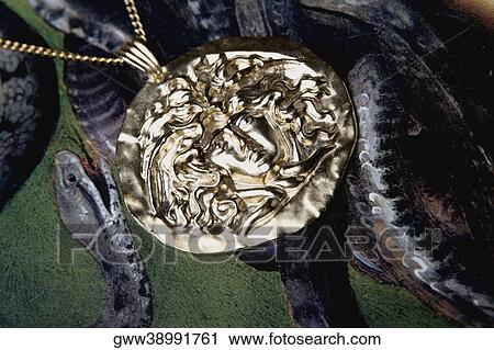 Close-up of a pendant on a necklace View Large Photo Image Stock Image - Close-up of a pendant on a necklace. Fotosearch