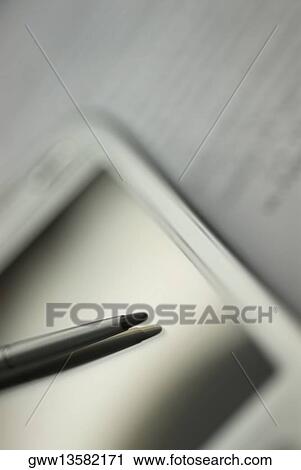 Stock Image - Close-up of a personal data assistant with a digitized pen. Fotosearch