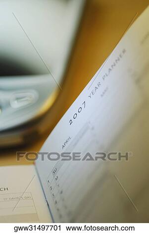 Close-up of a personal organizer with a personal data assistant View Large Photo Image Stock Image - Close-up of a personal organizer with a personal data assistant. Fotosearch