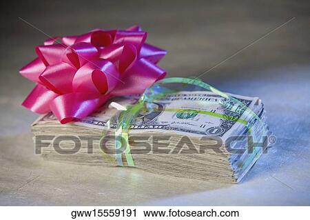 Close Up Of A Ribbon Flower On A Bundle Of One Dollar Bills