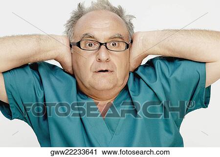 Close-up of a senior man looking shocked View Large Photo Image Stock Image - Close-up of a senior man looking shocked. Fotosearch