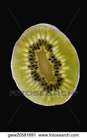 Close-up of a slice of kiwi View Large Photo Image Stock Image - Close-up of a slice of kiwi. Fotosearch